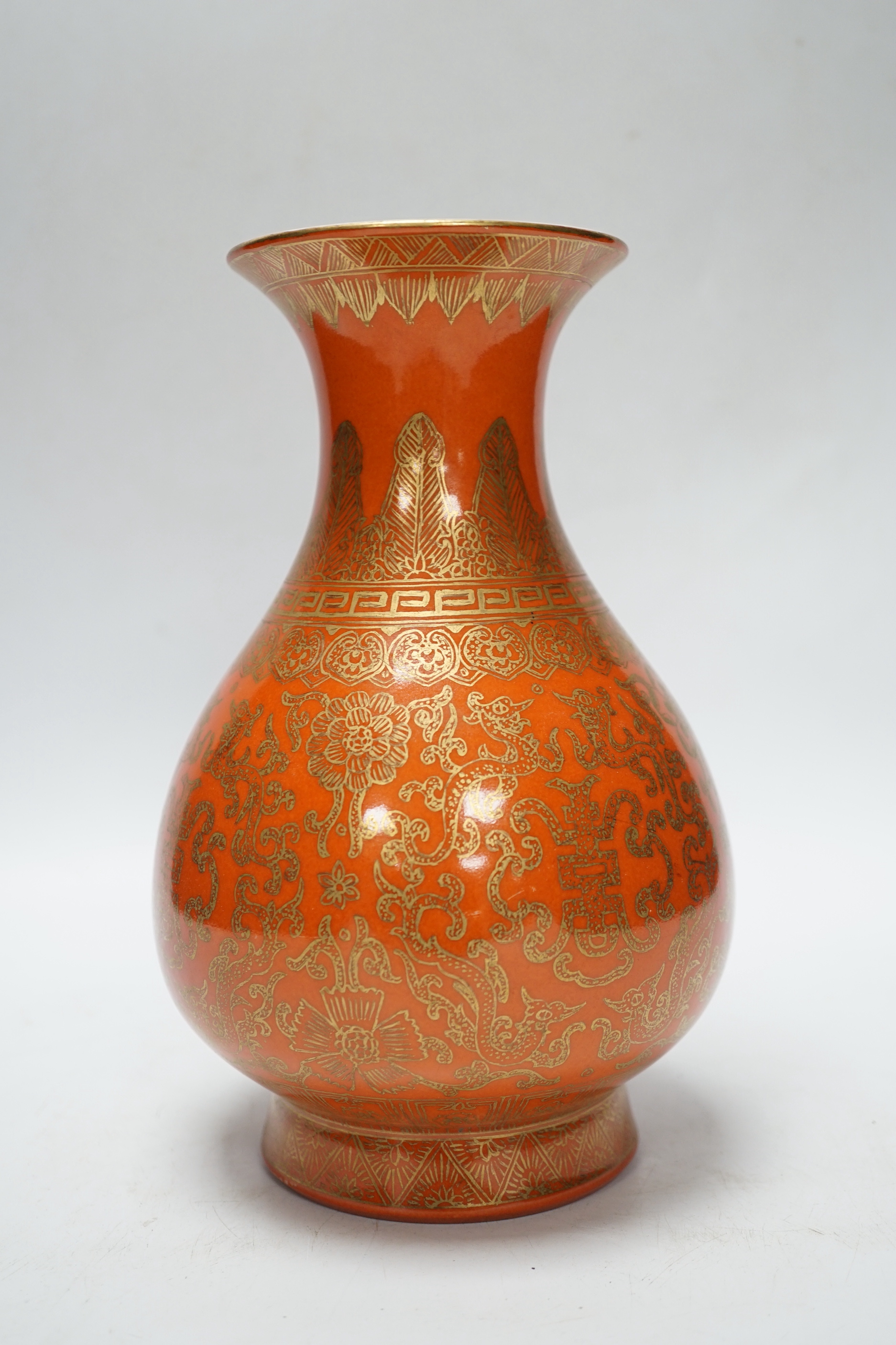 A Chinese coral ground and gilt vase, Qing mark, 21cm